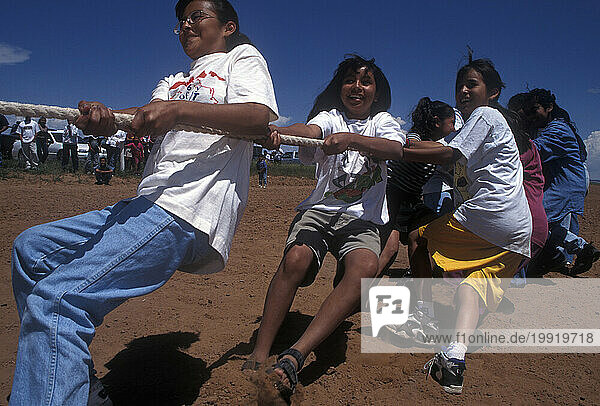 Kids compete in a tug-of-war contest.