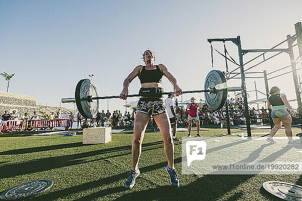 Female athlete lifting weights during competition  Tenerife  Canary Islands  Spain