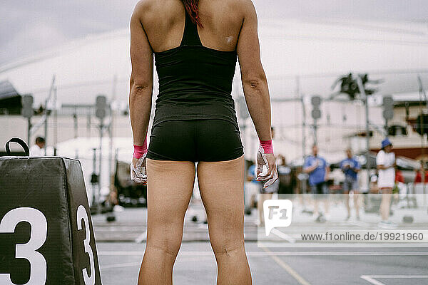 Women's CrossFit competition. Young woman crossfit athlete.