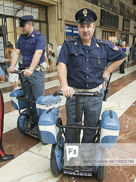 Italian policemen using motorized scooters