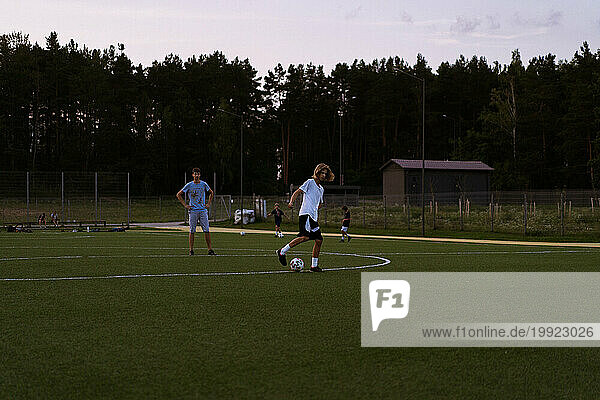 Boys junior soccer team practicing penalty.