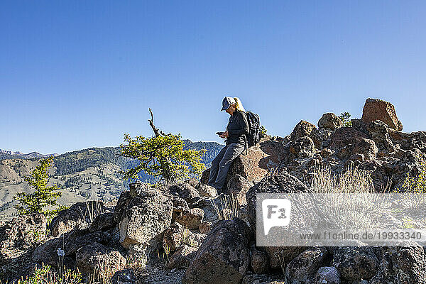 USA  Idaho  Sun Valley  Senior woman taking break while on hike