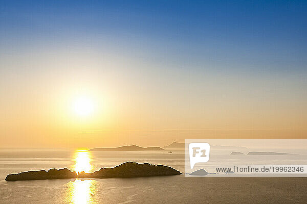 Greece  Ionian Islands  Sun setting over Nisida Kravi island