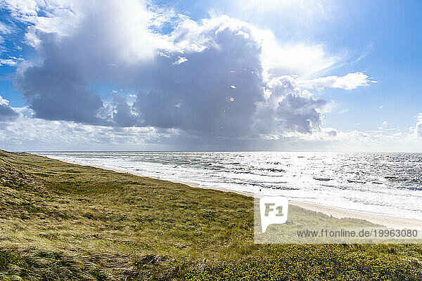 Germany  Schleswig-Holstein  Clouds over grassy shore of Sylt island