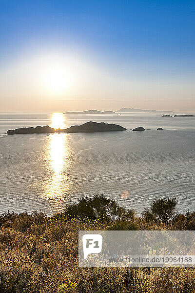 Greece  Ionian Islands  Sun setting over Nisida Kravi island