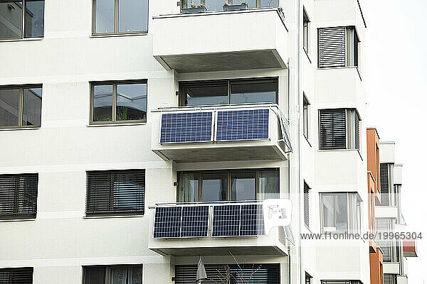 Germany  Baden-Wurttemberg  Freiburg im Breisgau  Solar panels on balconies of modern apartment building