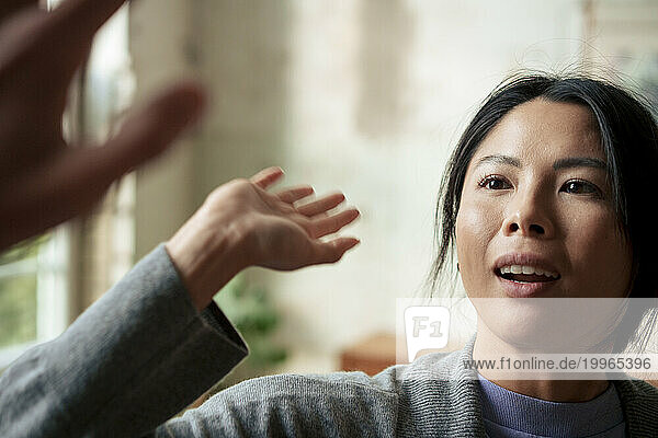 Woman giving high-five at art studio