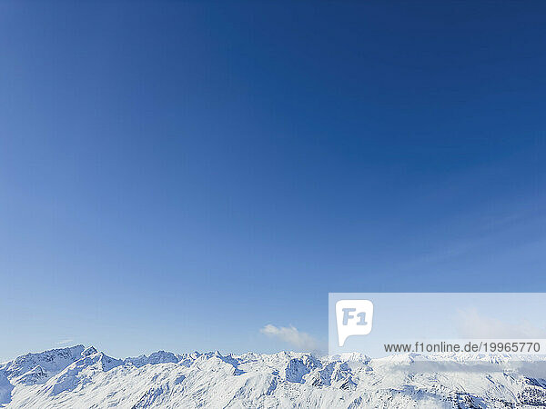 Austria  Tyrol  Axamer Lizum  Clear blue sky over snowcapped peaks of Alps