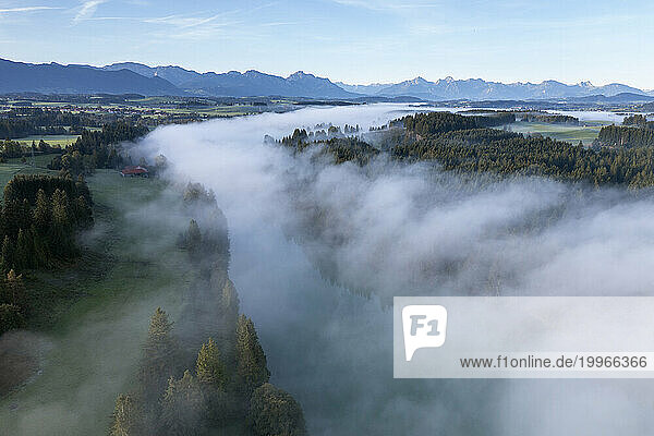 Germany  Bavaria  Aerial view of thick fog over river Lech in autumn