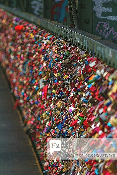 A multitude of colourful love locks attached to a bridge railing  Hohenzollern Bridge  Cologne Deutz  North Rhine-Westphalia  Germany  Europe
