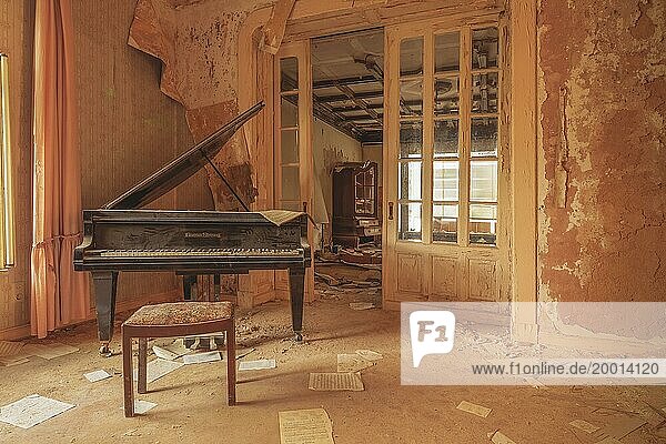 An old piano in a dilapidated room conveys a quiet melancholy  Urologist's villa Dr Anna L.  Lost Place  Bad Wildungen  Hesse  Germany  Europe