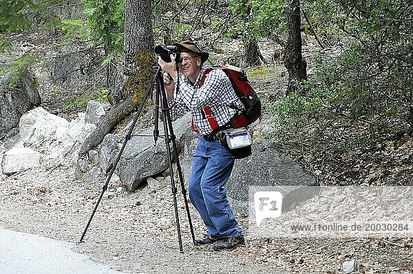 Tourist  professional photographer Yosemite National Park  California  USA  North America