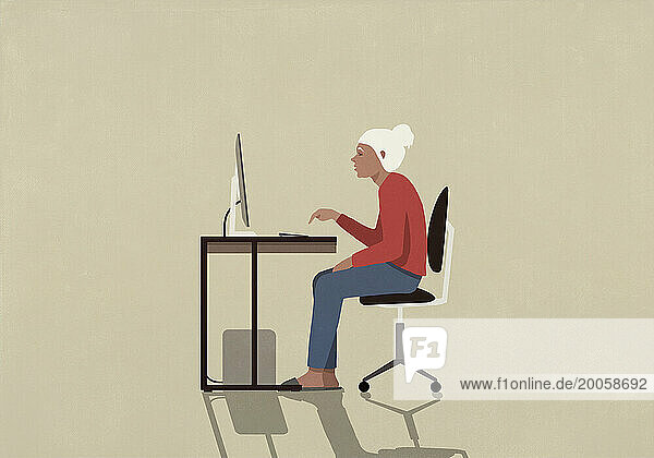 Senior woman using computer at desk