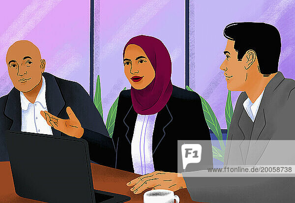 Businesswoman in hijab talking with colleagues in conference room meeting