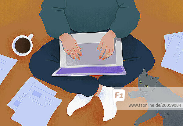 View from above woman with cat using laptop on floor with coffee and paperwork