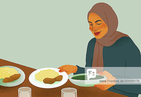 Smiling woman in hijab enjoying dinner at table
