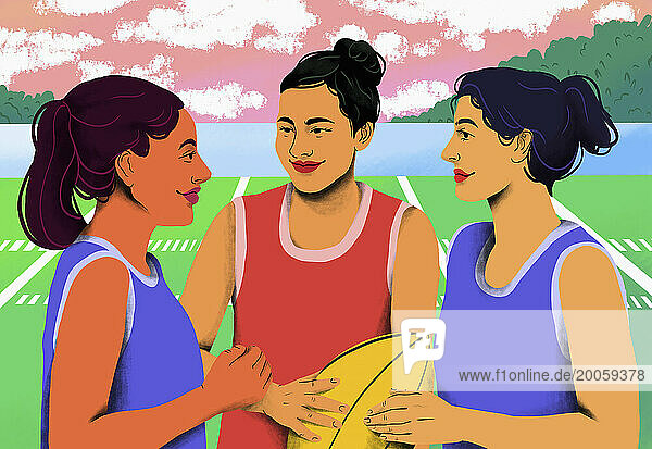 Young female rugby players talking on rugby field