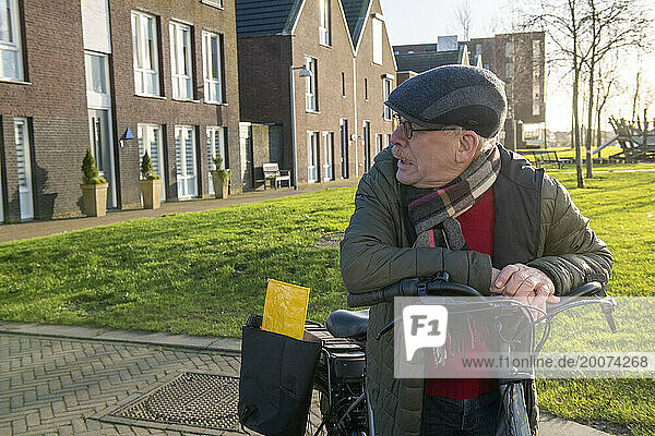 Elderly Man going for a bike ride to keep fit and healthy in her retirement