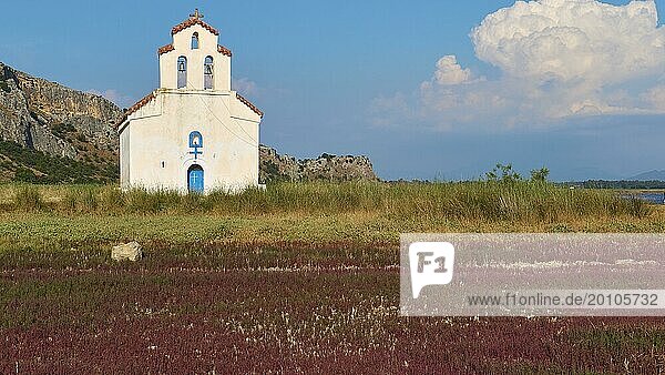 Agiou Petrou Chapel  Chapel of St Peter  white church with red roof in the middle of a peaceful landscape  Strofilia biotope  wetlands  Kalogria  Peloponnese  Greece  Europe