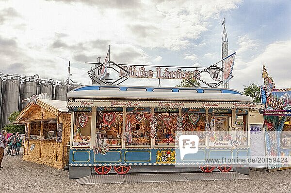 Folk festival and funfair stand  shape of Bavarian tram  almonds  sweets  children  moated castle am Inn  Bavaria