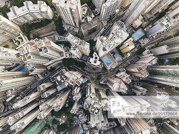 Modern tall buildings with winding road in Hong Kong city