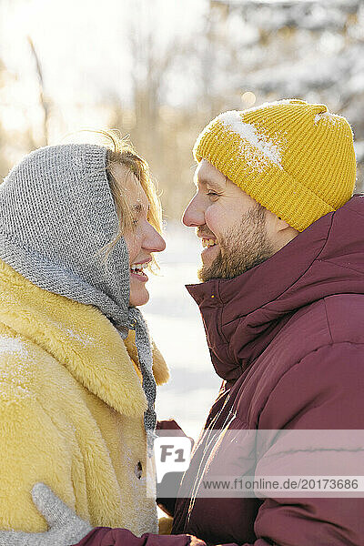 Cheerful couple enjoying in winter