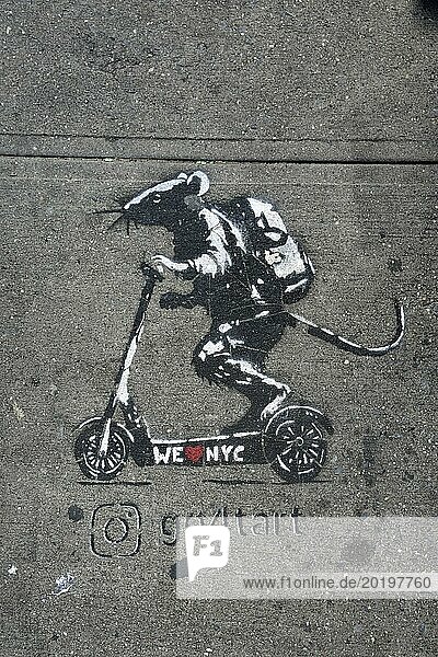 Graffiti on pavement  mouse with backpack on scooter with inscription We love NYC  SoHo neighbourhood  Manhattan  New York City  New York  USA  North America