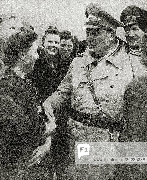 EDITORIAL Hermann Wilhelm Göring  or Goering  1893 –1946. German politician  military leader  and convicted war criminal. Seen here visiting bomb damaged areas in the Reich during WWII. From The War in Pictures  Fifth Year.