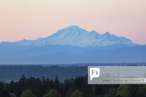 Stunning view of the snow covered peak of Mount Baker at twilight; British Columbia  Canada