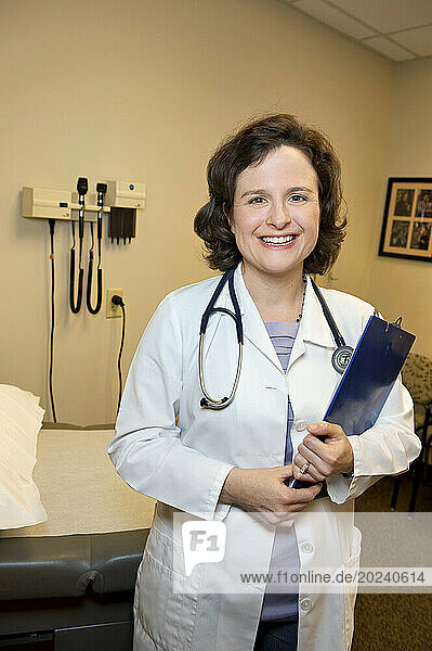 Physician's assistant holds a clipboard; Lincoln  Nebraska  United States of America