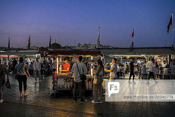 Street vendor in Eminonu Square at night in Fatih  Istanbul; Istanbul  Turkey