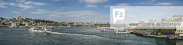 Panoramic view of river cruise boats on the Bosphorus and Ataturk Bridge in Istanbul; Istanbul  Turkey
