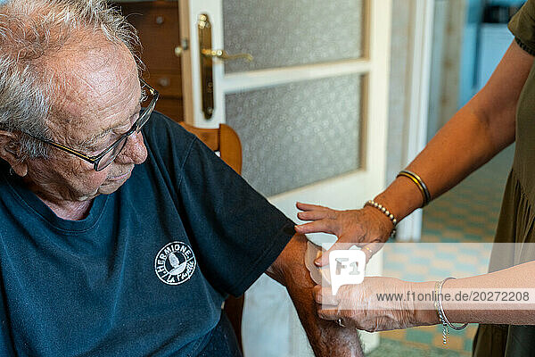Home care from a nurse for a 90-year-old senior and application of a patch.