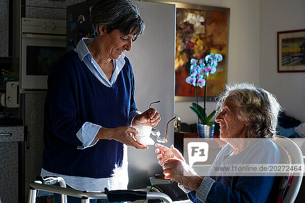 Liberal nurse visiting an elderly person.