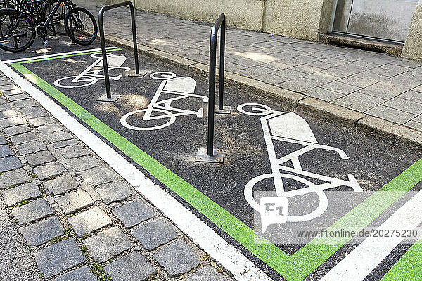 Symbols of bicycle parking on road at station