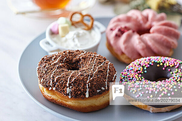 A group of donuts with different toppings