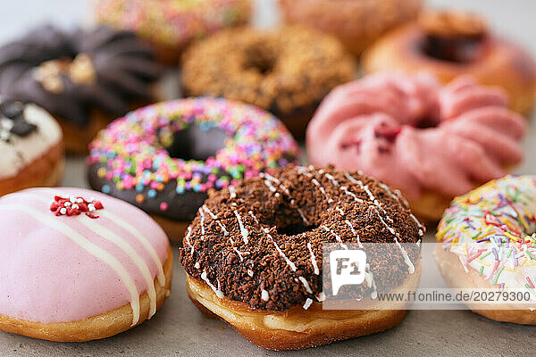 A group of donuts with different toppings