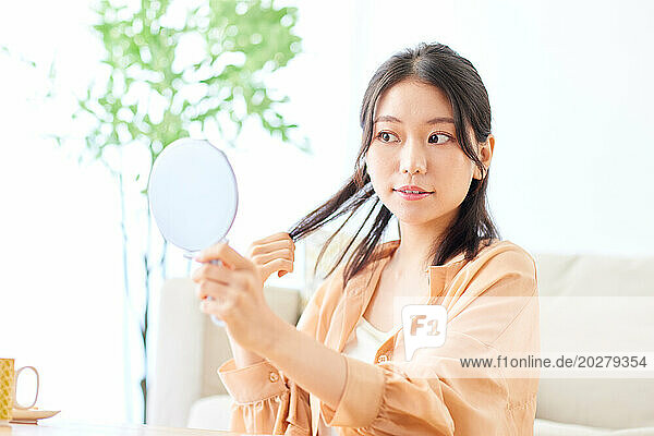 A woman holding a mirror