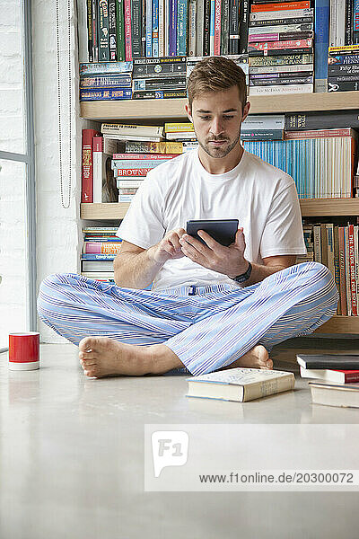 Man Using Digital Tablet at Home