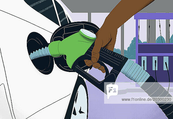 Close up hand holding green biofuel gas pump  refueling car at gas station
