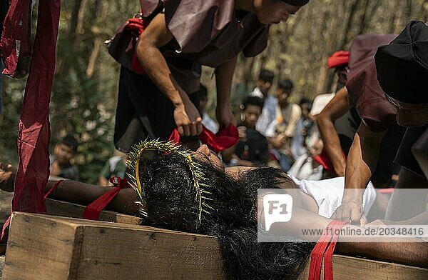 Christian devotees takes part in a perform to re-enactment of the crucifixion of Jesus Christ during a procession on Good Friday  on March 29  2024 in Guwahati  Assam  India. Good Friday is a Christian holiday commemorating the crucifixion of Jesus Christ and his death at Calvary