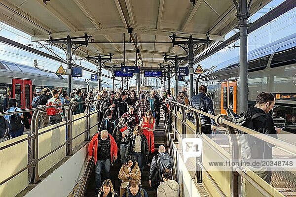 Lots of people and two local trains at the main railway station  Witten  North Rhine-Westphalia  Germany  Europe