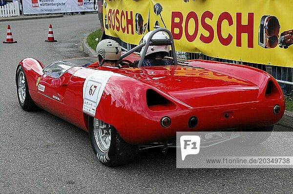 A red open-top racing car with a driver in full gear  SOLITUDE REVIVAL 2011  Stuttgart  Baden-Württemberg  Germany  Europe