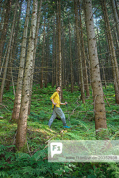 Young Man in Mountain Forest Enjoying Hiking During the Weekend