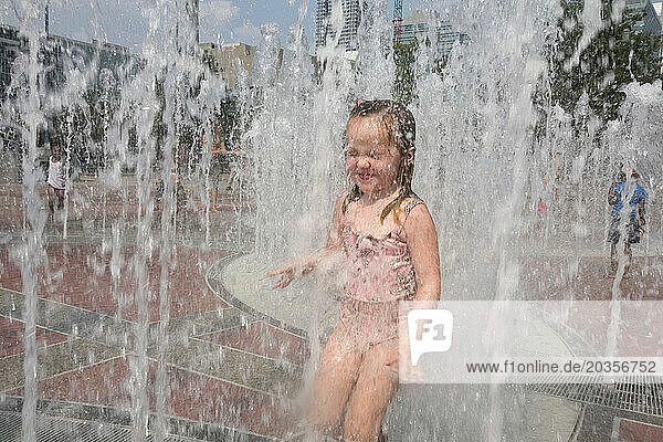 Children play in the Centennial Park Fountain  Atlanta  Ga.