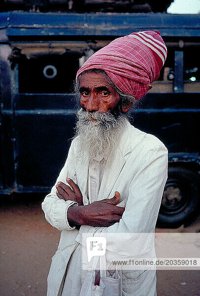 A village elder in India with turban and beard.