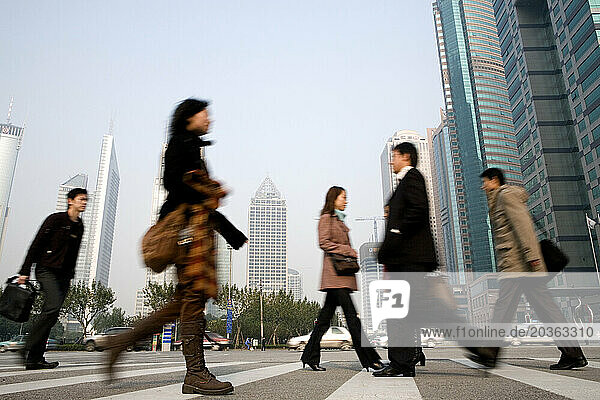 Workers on their pedestrian commute  Shanghai  China.
