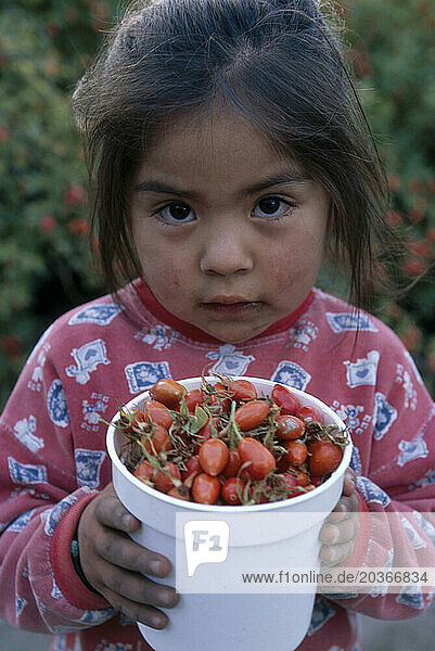 Girl with rosa mosqueta berries