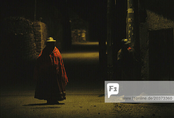 A woman walking at night  Chivay  Peru.