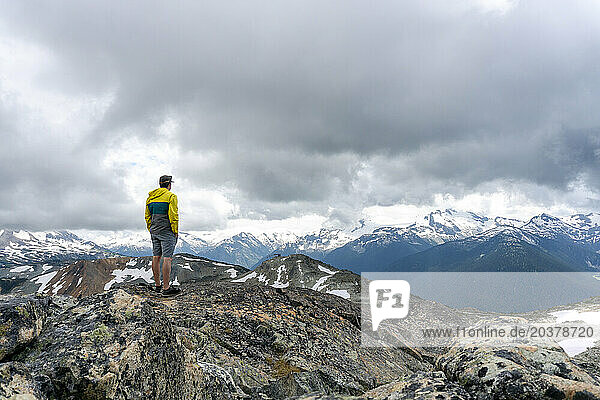 Man looking at view of Coast Mountains  Whistler  British Columbia  Canada